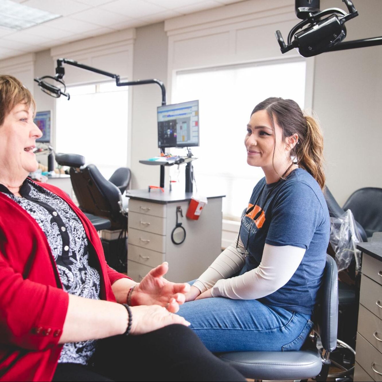 Patient consulting with a friendly staff member at Christopher Orthodontics